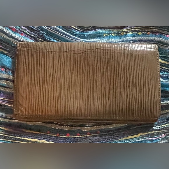 Brown Louis Vuitton epi-leather long wallet. Measures approximately 7 x 4”. GUC - Picture 1 of 14